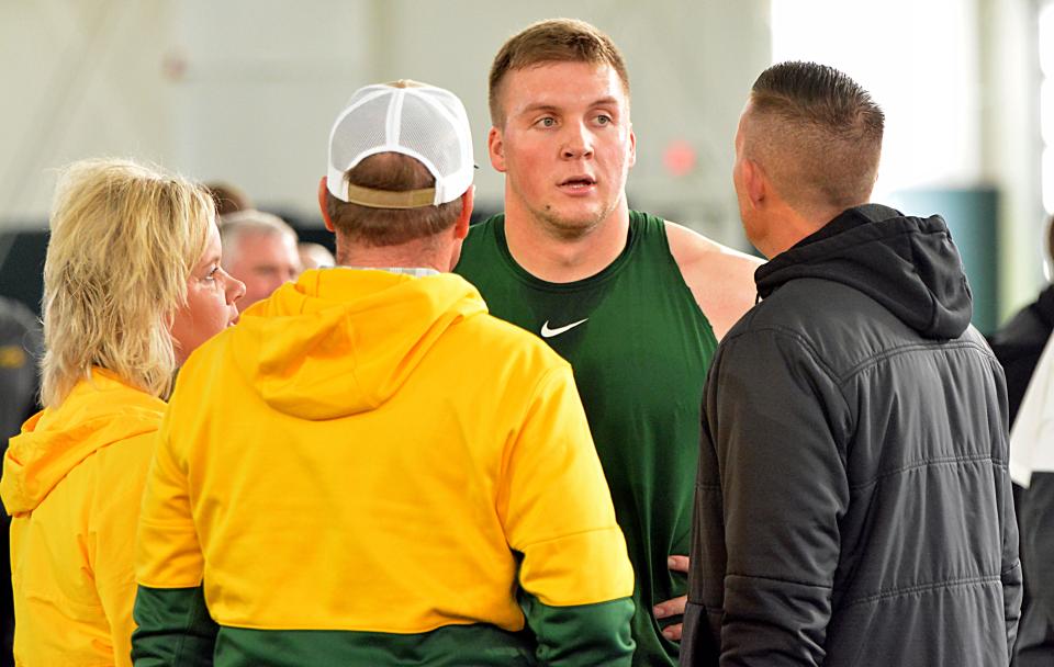 North Dakota State University defensive end Spencer Waege, a 2017 graduate of Watertown High School, visits his mother Lana, father Lynn and agent Chase Callahan during NDSU's NFL Pro Day on Wednesday, March 29, 2023 at the Nodak Insurance Football Performance Complex in Fargo, ND