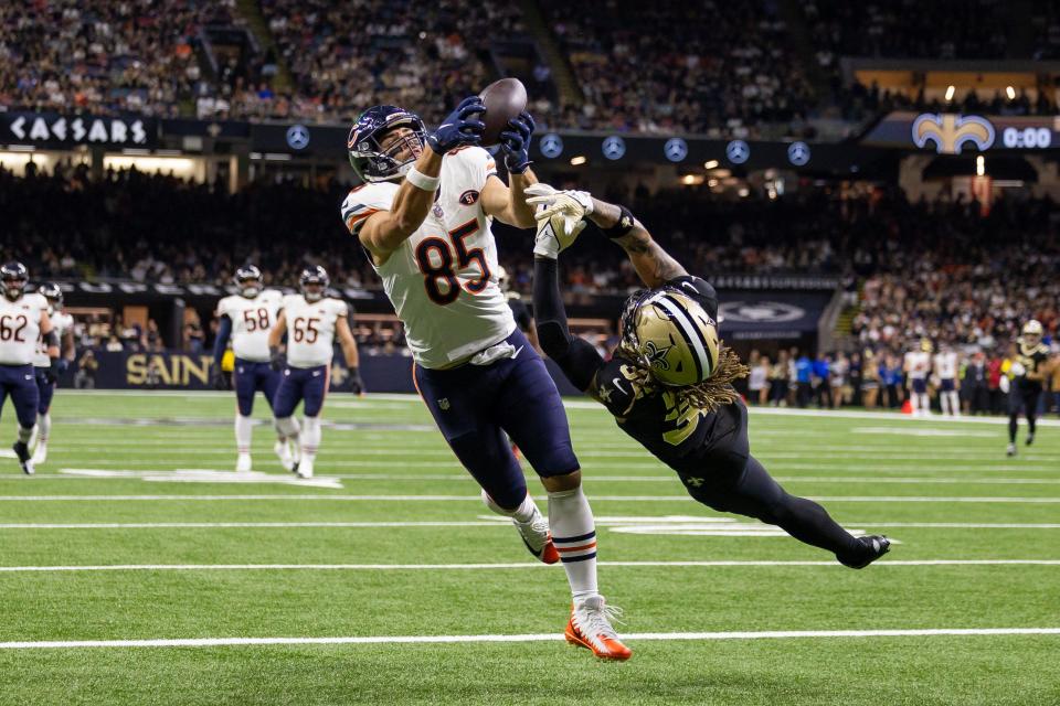 Chicago Bears tight end Cole Kmet (85) catches a touchdown pass over New Orleans Saints safety Tyrann Mathieu (32) during the first half at the Caesars Superdome.