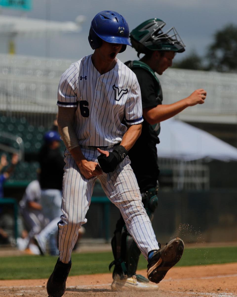 Lakeland player Colby Brewington celebrates after scoring a run. St. John Neumann faced off against Lakeland Christian High School in the state semi final game at Hammond Stadium in Fort Myers, Thursday May 18, 2023. The Lakeland Christian Vikings won with a final score of 3-0.