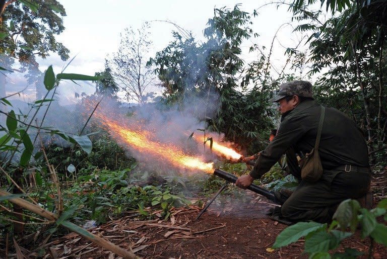 Rebel soldiers fire rockets from an outpost in Myanmar's Kachin state, on September 22, 2012. Fighting between the country's military, known as the Tatmadaw, and the armed wing of the KIO -- the Kachin Independence Organization -- has worsened in recent days as the army battled to regain one of its bases