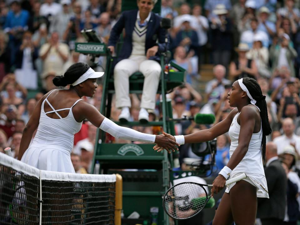 Coco Gauff (right) shakes hands with Venus Williams after their match at Wimbledon 2019.
