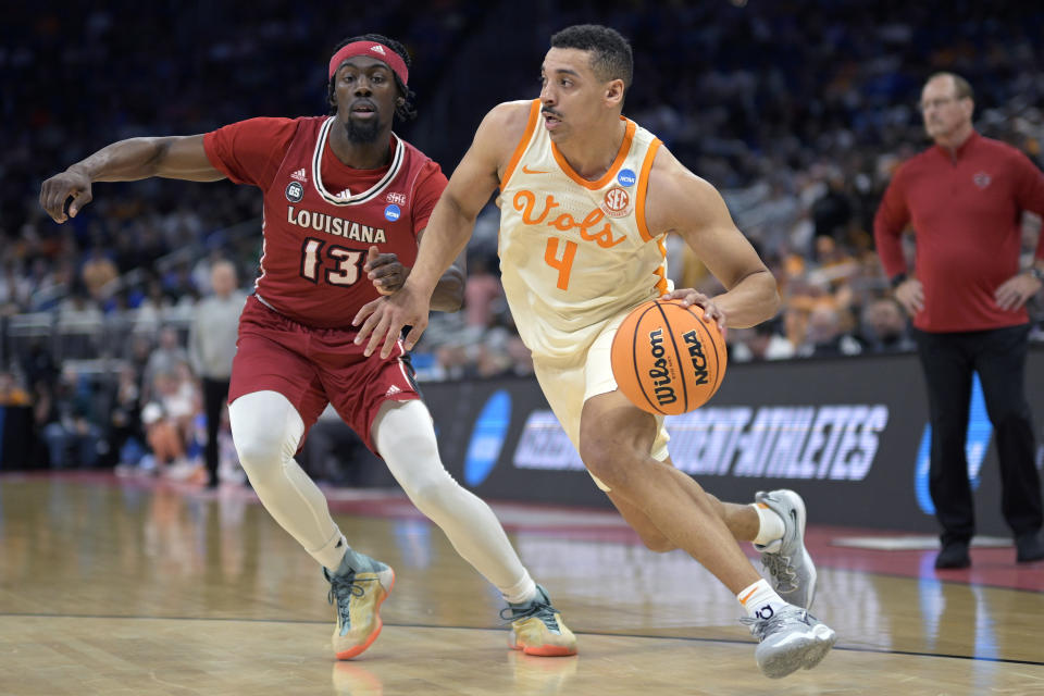 Tennessee guard Tyreke Key (4) drives to the basket as Louisiana guard Greg Williams Jr. (13) defends during the first half of a first-round college basketball game in the NCAA Tournament, Thursday, March 16, 2023, in Orlando, Fla. (AP Photo/Phelan M. Ebenhack)