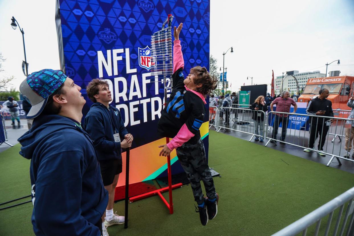 Drake Baotman, 10, of Algonac, Mich. participates in the vertical jump test during the NFL Draft Experience in Downtown Detroit on Saturday, April 27, 2024.