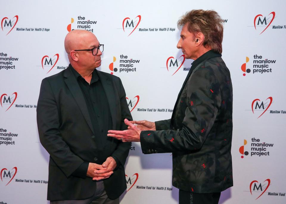 Barry Manilow meets with Doug Elmore, a teacher at Floyd Central High School on Monday, August 21, 2023.  Elmore, a teacher at the school for 38 years, received $10,000 from Manilow’s Music Teacher Award