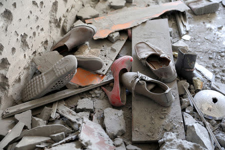 Shoes are pictured in a house damaged by shelling during the fighting between the eastern forces and internationally recognized government is pictured in Abu Salim in Tripoli, Libya April 15, 2019. REUTERS/Hani Amara