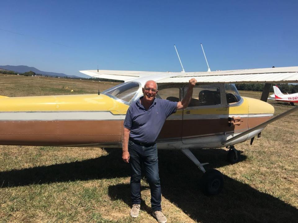 Ted Gray standing outside his plane.