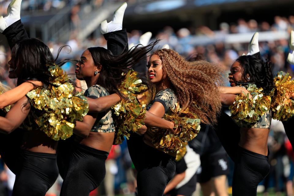 Taylor B., center, with The ROAR of the Jaguars cheerleading squad performs during the first quarter an NFL football matchup Sunday, Nov. 19, 2023 at EverBank Stadium in Jacksonville, Fla. The Jacksonville Jaguars defeated the <a class="link " href="https://sports.yahoo.com/nfl/teams/tennessee/" data-i13n="sec:content-canvas;subsec:anchor_text;elm:context_link" data-ylk="slk:Tennessee Titans;sec:content-canvas;subsec:anchor_text;elm:context_link;itc:0">Tennessee Titans</a> 34-14. [Corey Perrine/Florida Times-Union]