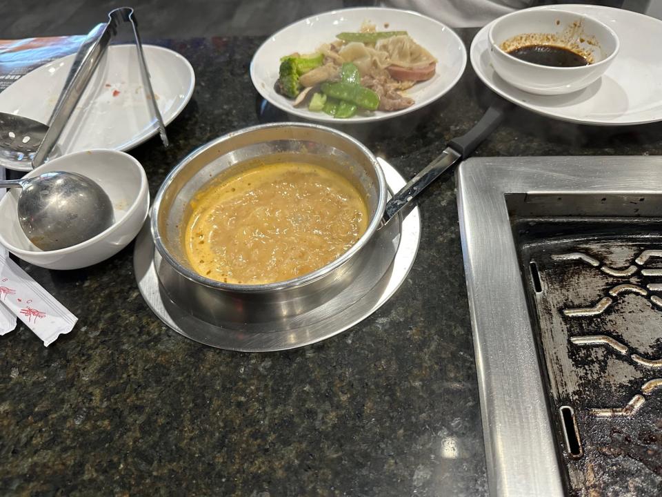 Hot Pot and BBQ Buffet diners have a choice of seven soup bases in which to cook selected meat, seafood, vegetables and dumplings tableside. The restaurant is located at 3050 Lindbergh Blvd., Springfield.