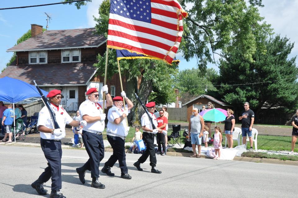 Color guard of the American Legion Post 166 in Alliance leads the 2023 Carnation Festival Grand Parade down State Street on Aug. 12, 2023.