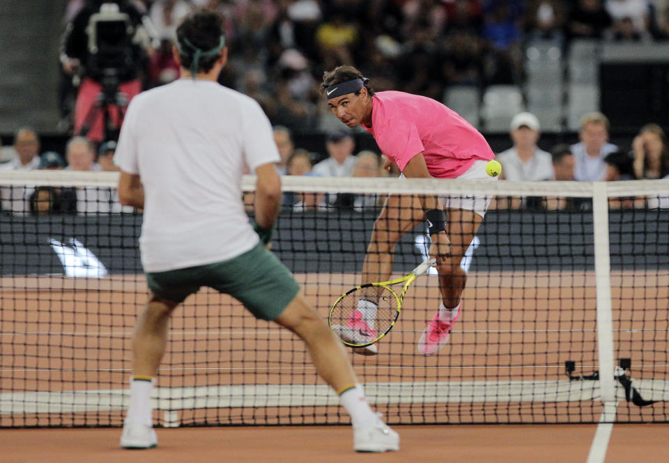 Rafael Nadal in action during the exhibition tennis match against Roger Federer, held at the Cape Town Stadium in Cape Town, South Africa, Friday Feb. 7, 2020. (AP Photo/Halden Krog)