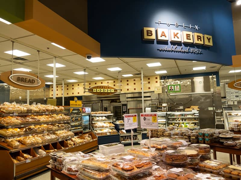 The bakery department of a Publix grocery store where all sorts of tasty baked goods are displayed.