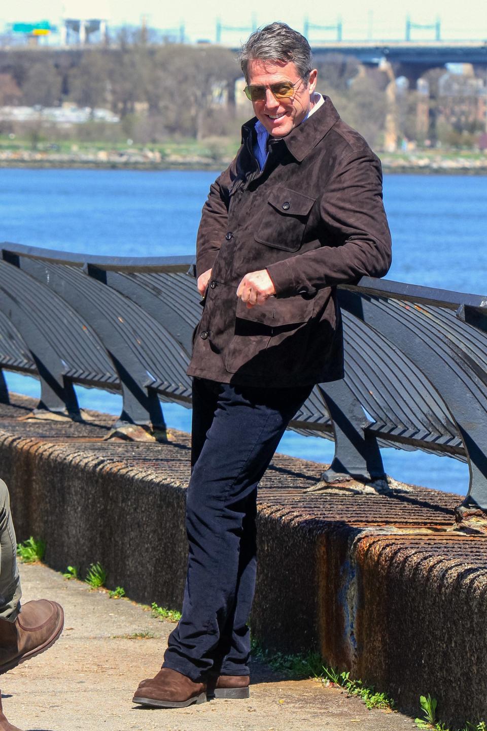 Hugh Grant strikes a laid-back pose beside the water in N.Y.C. on Tuesday. 