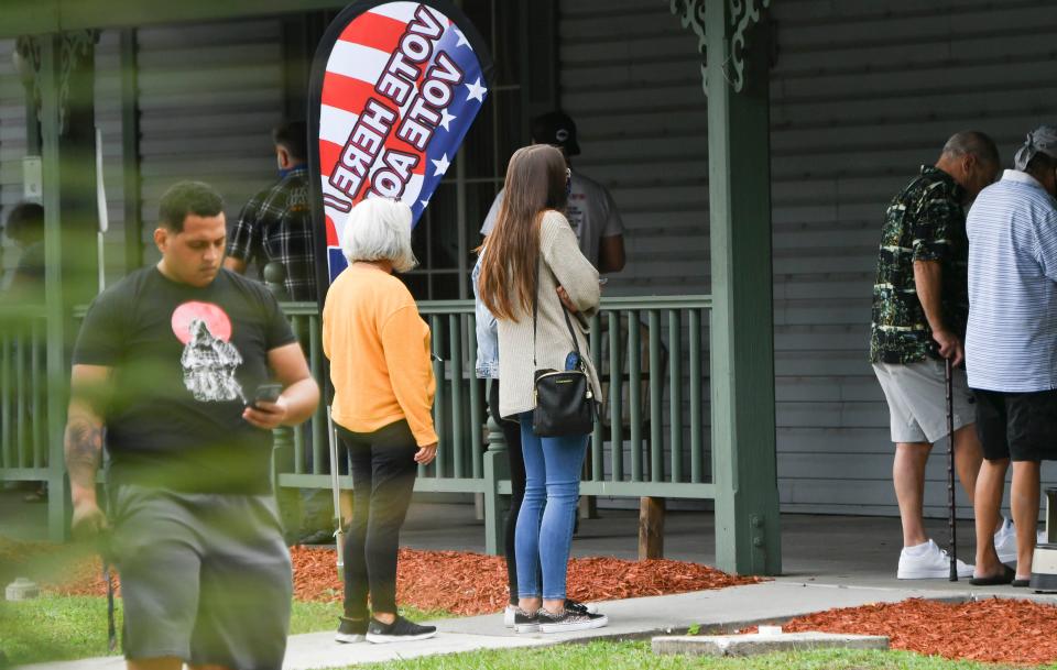 Voters enter and leave the DeGroodt Public Library in Palm Bay, FL to cast their ballots Tuesday, Nov. 3, 2020. Mandatory Credit: Craig Bailey/FLORIDA TODAY via USA TODAY NETWORK