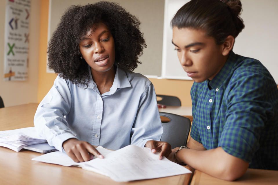 person tutoring a student