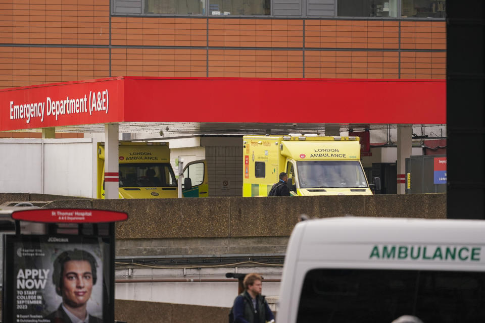 Ambulances are parked outside St Thomas' Hospital, in London, Thursday, Dec. 1, 2022. Some 10000 ambulance staff have voted to strike over pay and working conditions, along with a possible 100,000 nurses going on strike on Dec1. 5, leading the Government to set up contingency plans to cope with a wave of walkouts with Cabinet Minister Oliver Dowden in charge. (AP Photo/Alberto Pezzali)