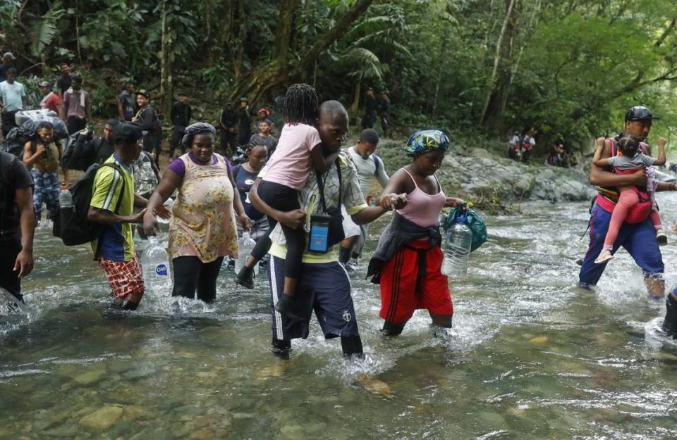 Haitian migrants walk on their way to Panama through the Darien Gap in Acandi, Colombia, in September 2021.