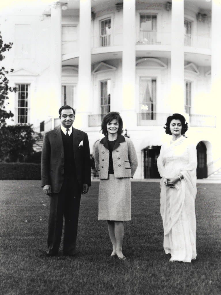 Prime Minister Jawaharlal Nehru, Jacqueline Kennedy, and Indira Gandhi pose together in front of the White House