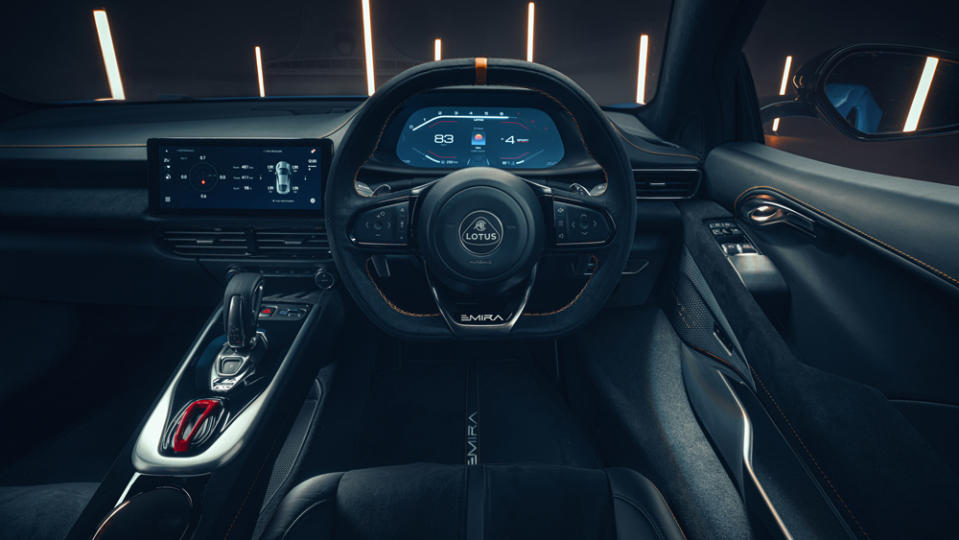 The Emira’s cockpit features a wraparound dash, elevated gear shifter and a flat-bottomed steering wheel with integrated controls. - Credit: Photo by Richard Pardon, courtesy of Lotus Cars Limited.