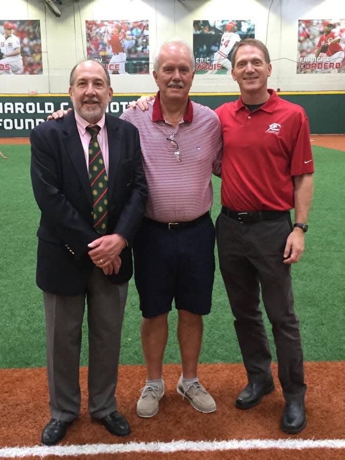 Dave Dierker, center, is joined by Brian Leshner of SAF/ABC and Charley Frank of the Reds Community Fund.