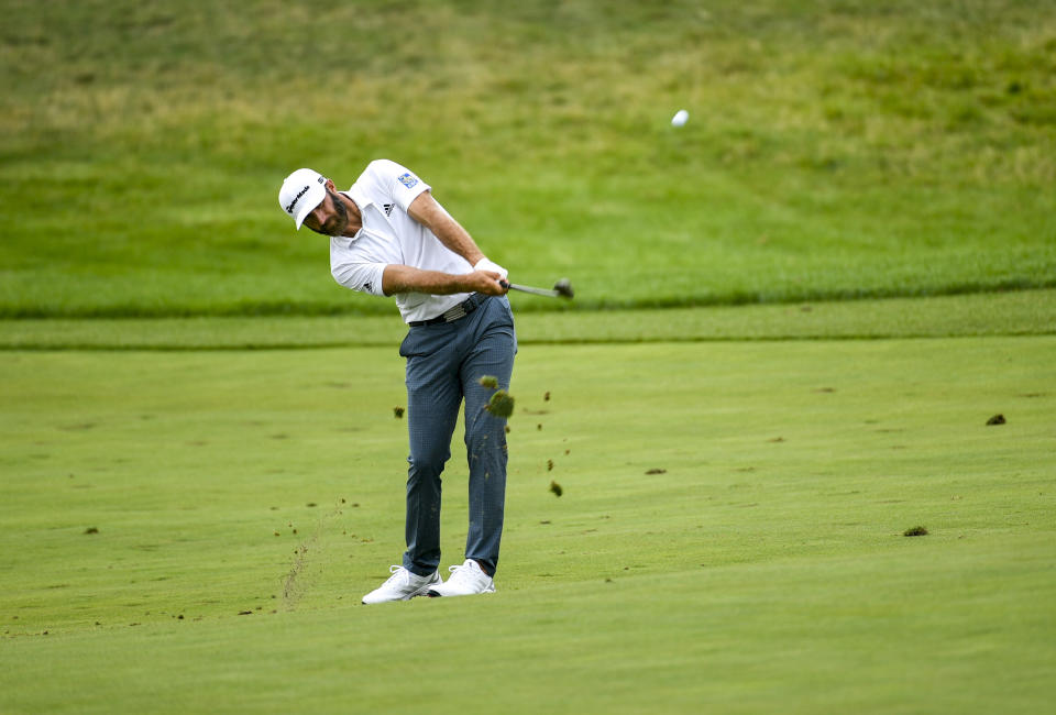 Dustin Johnson hits onto the green on the first hole during the first round of the 3M Open golf tournament in Blaine, Minn., Thursday, July 22, 2021. (AP Photo/Craig Lassig)