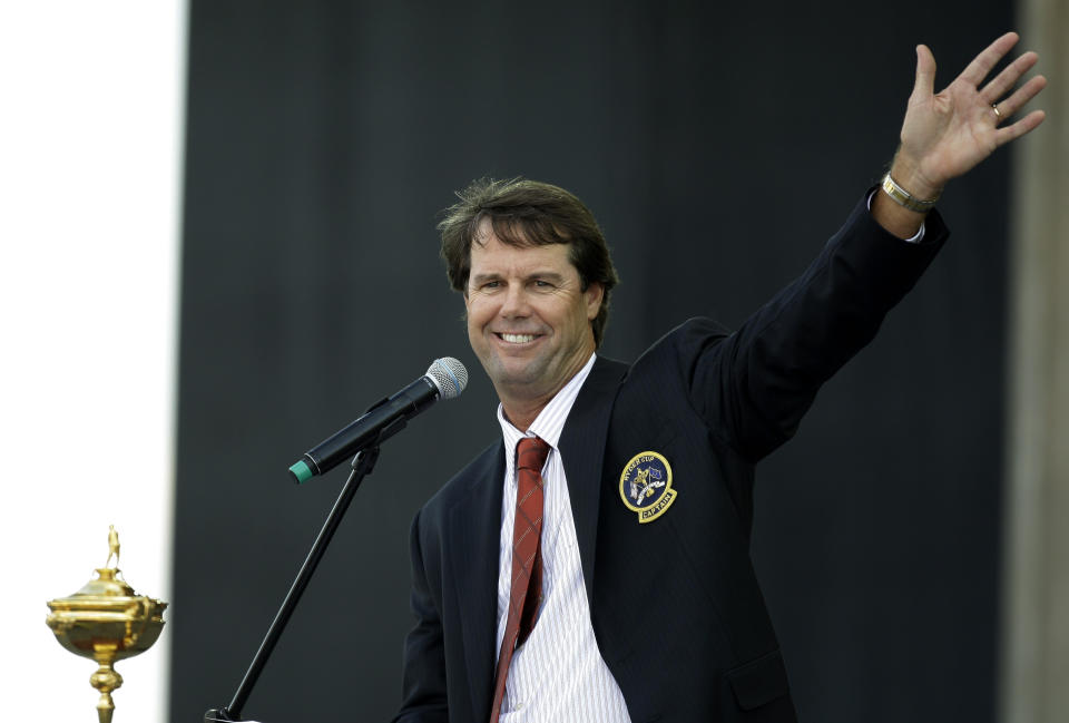 FILE - United States team captain Paul Azinger waves to spectators while speaking at the Ryder Cup opening ceremonies at the Valhalla Golf Club in Louisville, Ky., Sept. 18, 2008. Paul Azinger will no longer be the lead golf analyst for NBC Sports, ending his five years with the network at the Ryder Cup without even knowing that was his last event. (AP Photo/Chris O'Meara, File)