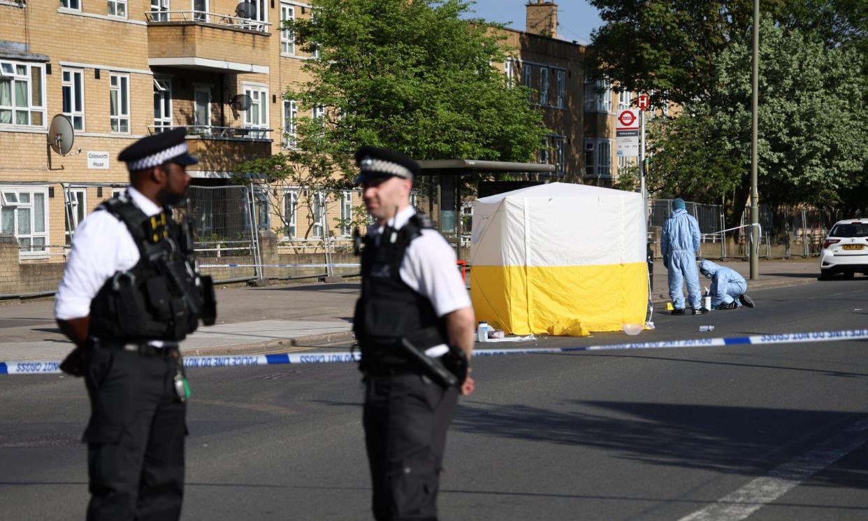 <span>The area of the attack at Burnt Oak Broadway, Edgware, remains cordoned off while forensic examinations are completed. </span><span>Photograph: Nigel Howard/Nigel Howard Media</span>