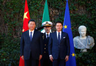 Chinese President Xi Jinping and Italian Prime Minister Giuseppe Conte stand during a welcoming ceremony at Villa Madama in Rome, Italy March 23, 2019. REUTERS/Yara Nardi