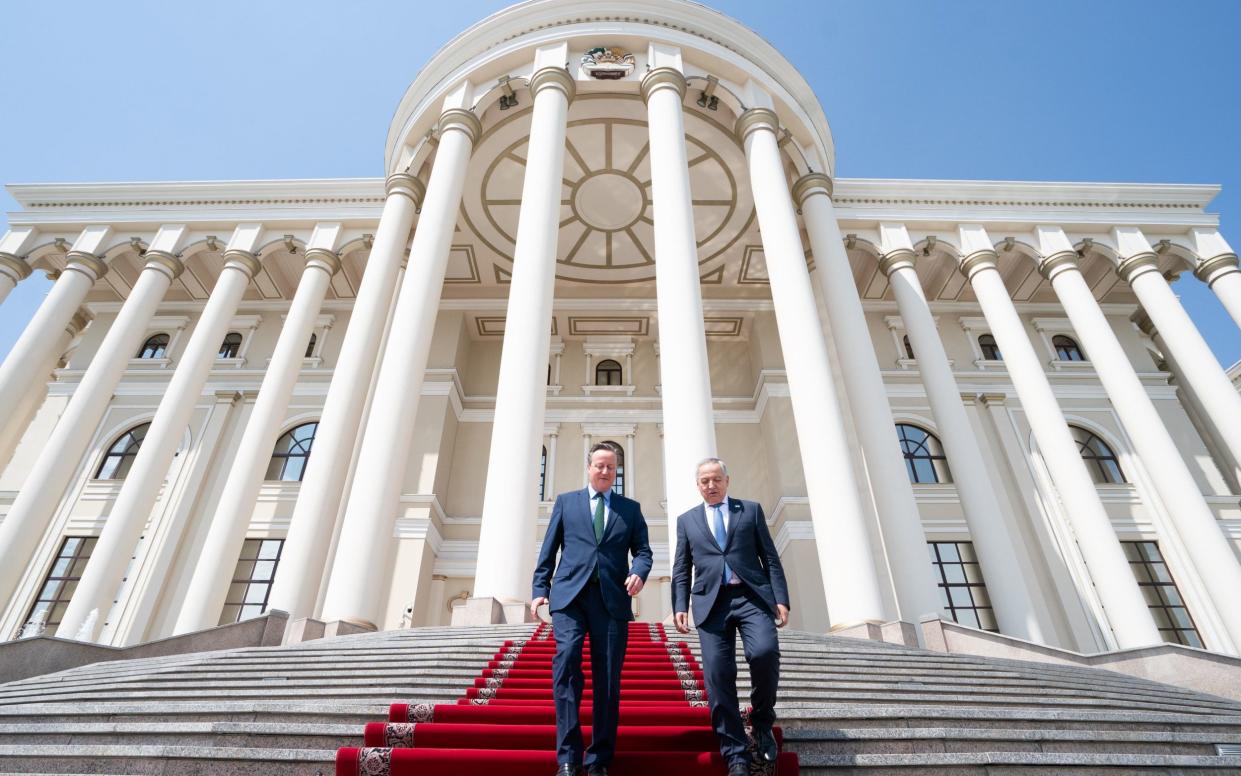 Lord Cameron, the Foreign Secretary, is pictured today with Sirojiddin Muhriddin, the Tajik foreign minister, during a visit to Dushanbe, Tajikistan