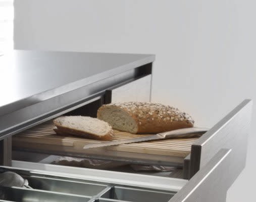 Look for creative ways to conceal kitchen essentials. Integrate a pull-out chopping board, and serving trays slotted into your cabinetry. So organised, you’ll have plenty of time to cook up a storm.<br><br><a rel="nofollow" href="https://au.lifestyle.yahoo.com/better-homes-gardens/g/21730163/before/21730173/" data-ylk="slk:READ MORE: Kitchen makeover under $2000;elm:context_link;itc:0;sec:content-canvas" class="link ">READ MORE: Kitchen makeover under $2000 </a>