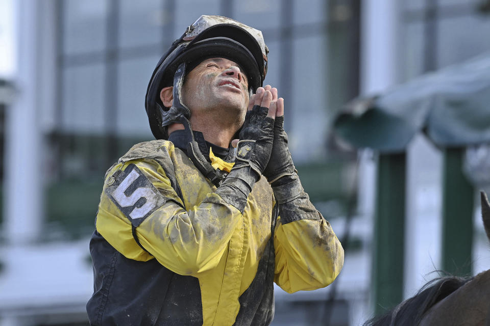 This photo provided by Equi-Photo shows jockey Jose Ferrer gesturing after winning the Salvatore Mile aboard Informative at Monmouth Park Racetrack in Oceanport, N.J., Saturday June 12, 2021. Ferrer, 57, is leading all jockeys in wins at Monmouth Park in New Jersey after 10 days of racing with 16 wins in 56 mounts. (Joe Labozxetta/Equi-Photo via AP)