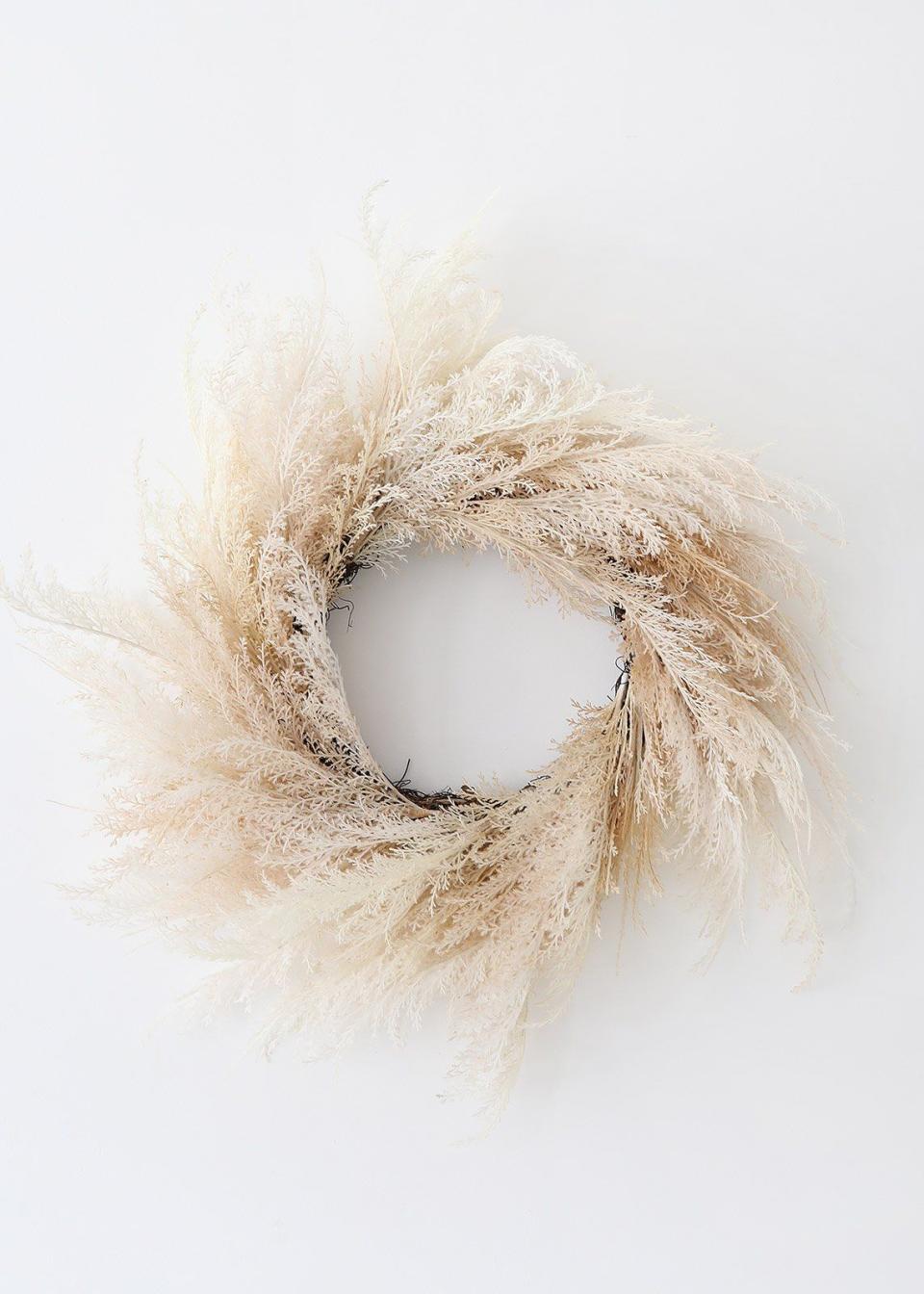 <p><strong>AFloral</strong></p><p>myshopify.com</p><p><strong>$48.00</strong></p><p><a href="https://afloral.myshopify.com/products/neutral-beige-faux-pampas-grass-wreath-36" rel="nofollow noopener" target="_blank" data-ylk="slk:Shop Now;elm:context_link;itc:0;sec:content-canvas" class="link ">Shop Now</a></p><p>Billowy faux pampas grass on a grapevine base looks just as sophisticated in the fall as it does in spring or summer.</p>