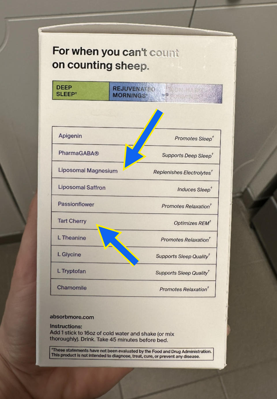 Hand holding a box of "Deep Sleep Assistant" with a list of ingredients and their supposed benefits for improved sleep