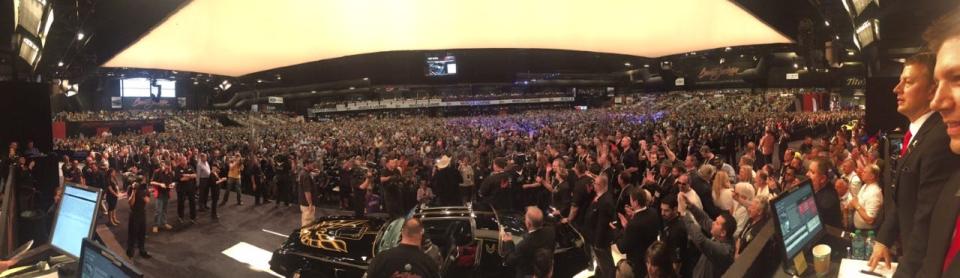 Burt Reynolds on stage at the 2016 auction of the Smokey and the Bandit promo car.