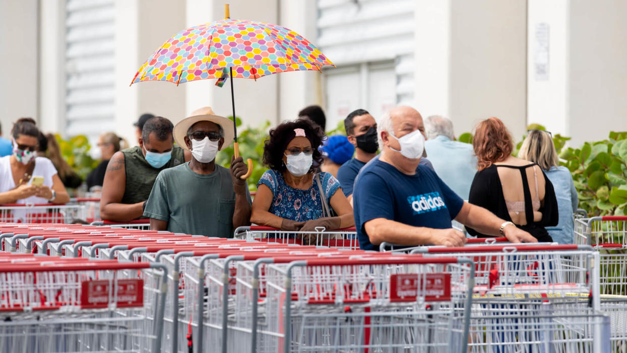 MIAMI, FL, USA - APRIL 22, 2020: Americans wearing face masks to stop spread of Coronavirus Covid 19 pandemic.