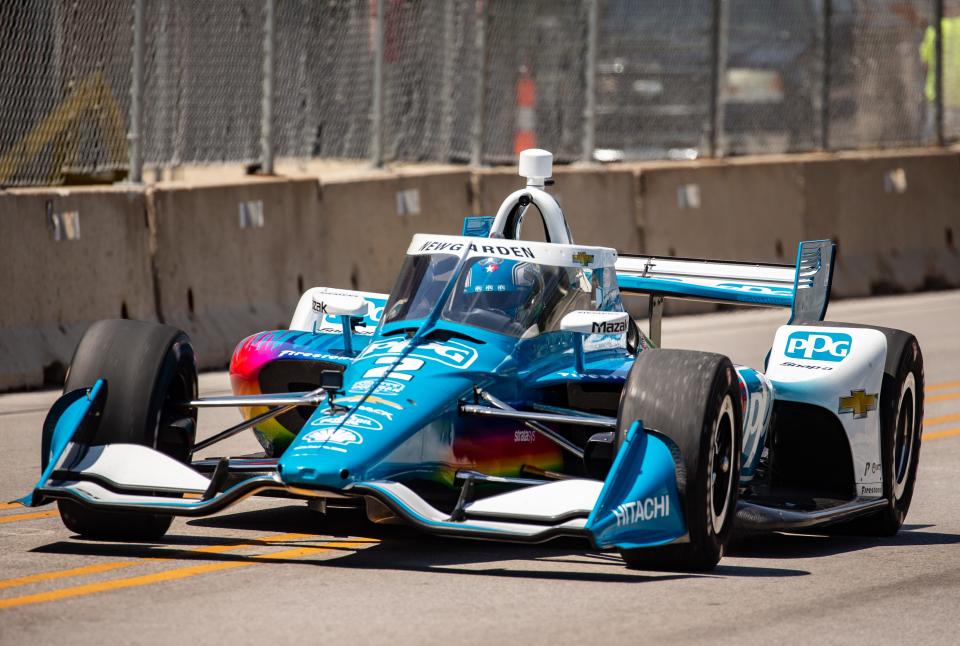 IndyCar driver Josef Newgarden, of the No. 2 Hitachi Chevrolet drive his car down Grand Avenue in Des Moines, Tuesday, June 21, 2022.