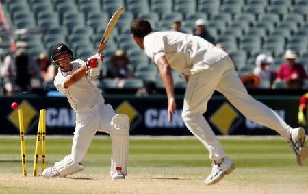 Australia's Josh Hazlewood (R) bowls New Zealand's Trent Boult for five runs during the third day of the third cricket test match at the Adelaide Oval, in South Australia, November 29, 2015. REUTERS/David Gray