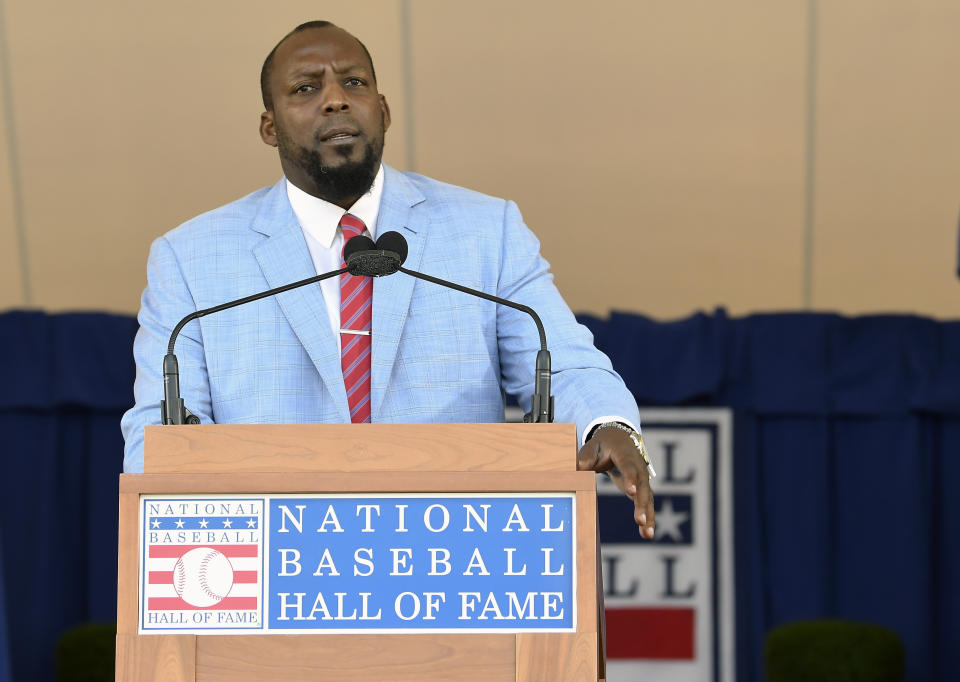 National Baseball Hall of Fame inductee Vladimir Guerrero speaks during an induction ceremony at the Clark Sports Center on Sunday, July 29, 2018, in Cooperstown, N.Y. (AP Photo/Hans Pennink)