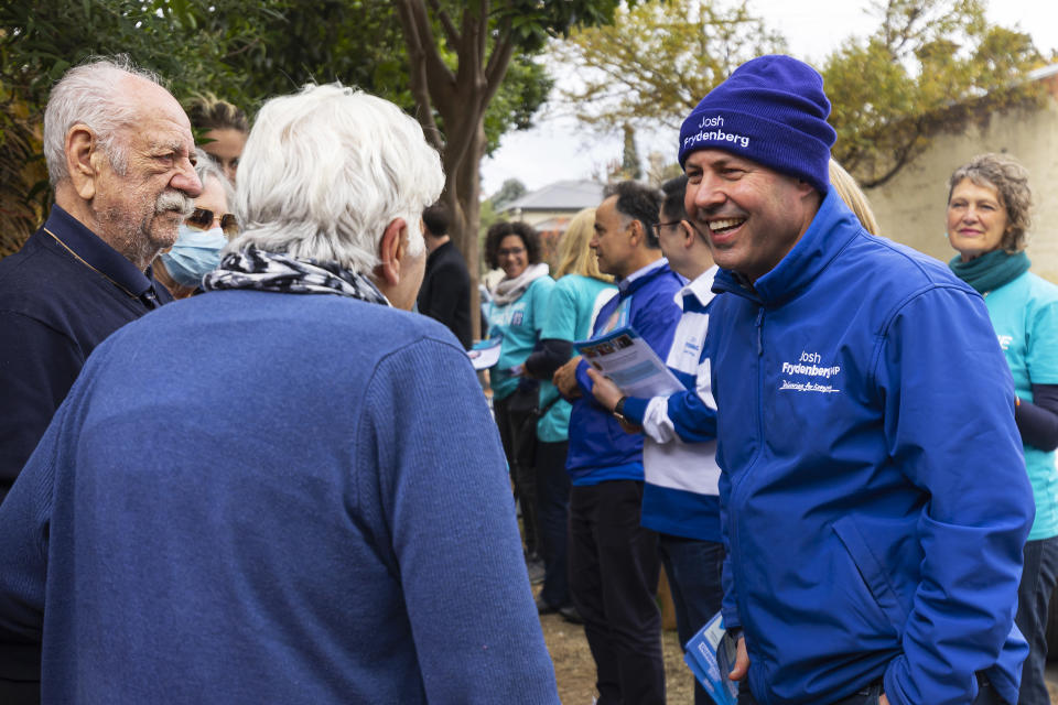 Liberal candidate for Kooyong Josh Frydenberg speaks to voters at a pre-polling centre in Hawthorn.