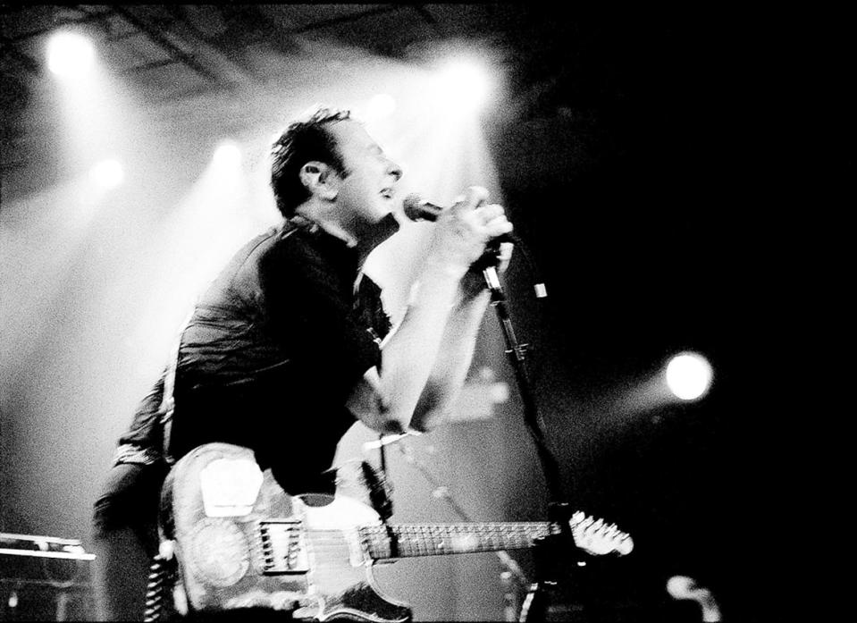 <div class="inline-image__caption"><p>Joe Strummer performing at his last concert in Brooklyn. 2001. </p></div> <div class="inline-image__credit">Josh Cheuse</div>