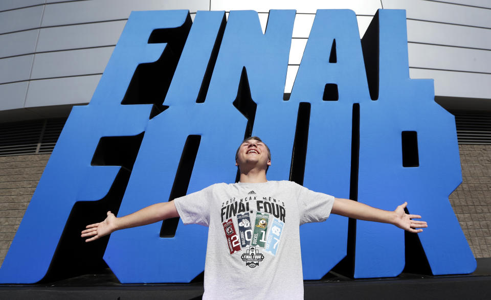 Keenan Rowein, of Edmonton, Alberta, poses for a photo outside of University of Phoenix Stadium before the Final Four NCAA college basketball tournament championship game between North Carolina and Gonzaga, Monday, April 3, 2017, in Glendale, Ariz. (AP Photo/Charlie Neibergall)