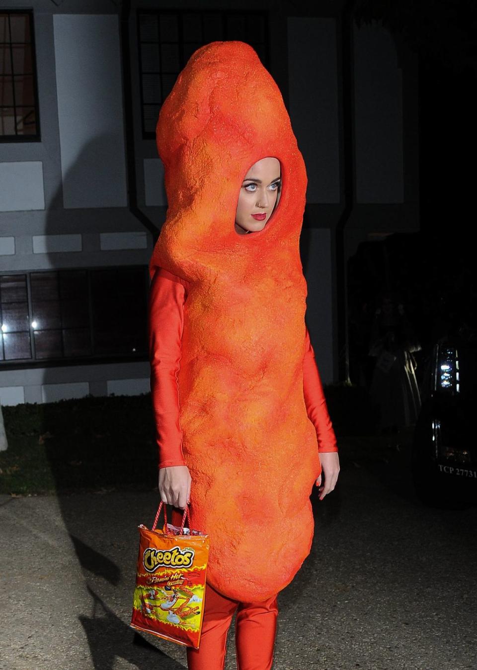 <p>Now, this costume would make us hungry. Katy lived up to the saying, "You are what you eat," when she arrived at Kate Hudson's Halloween party as a tasty Cheeto. </p>