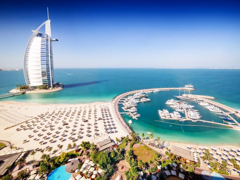 The towering Burj Al Arab hotel, overlooking Dubai marina (istock)