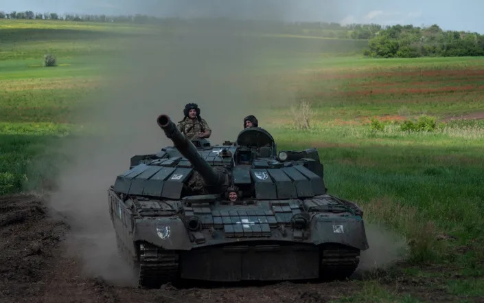 A Ukrainian tank rides near Chasiv Yar, the site of fierce battles with Russian forces - Ryna Rybakova/AP
