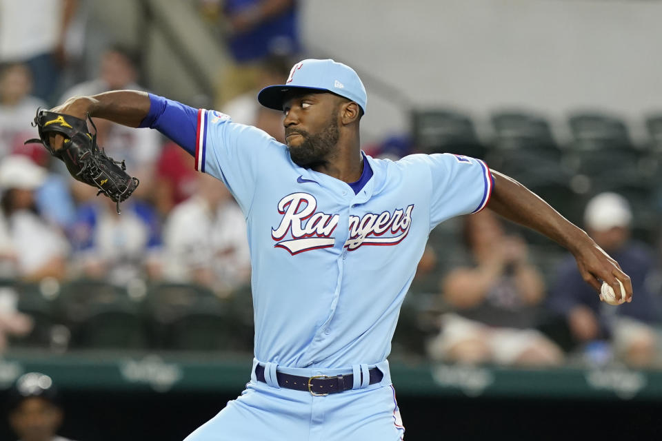 Texas Rangers starting pitcher Taylor Hearn throws during the first inning of a baseball ball game against the Atlanta Braves in Arlington, Texas, Sunday, May 1, 2022. (AP Photo/LM Otero)