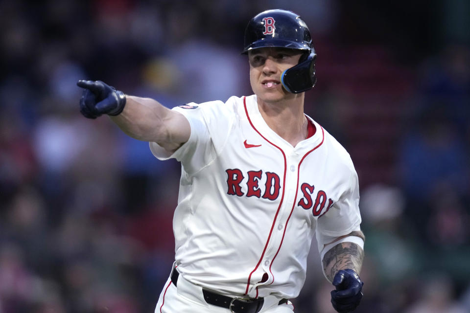 Boston Red Sox's Tyler O'Neill points toward the dugout while celebrating after his three-run home run during the first inning of a baseball game against the Tampa Bay Rays at Fenway Park, Monday, May 13, 2024, in Boston. (AP Photo/Charles Krupa)