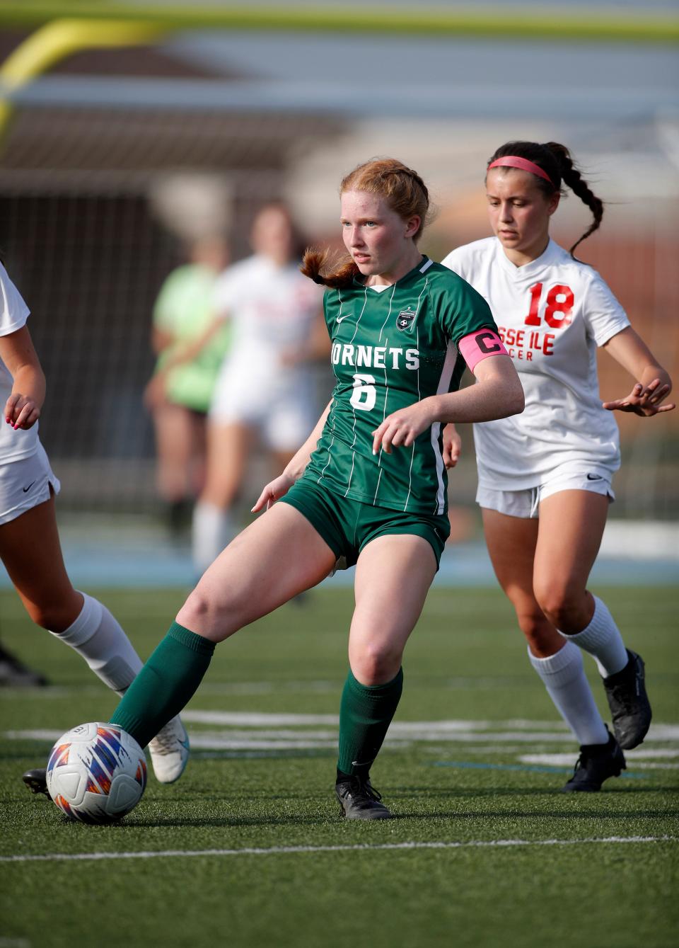 Williamston's Emma Gorsline controls the ball against Grosse Ile's Ella Gatti, Thursday, June 8, 2023, at Lansing Catholic High School.