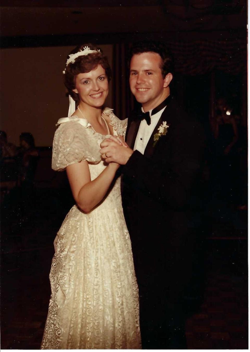Tim and Melinda O'Brien dance at their wedding in 1983.