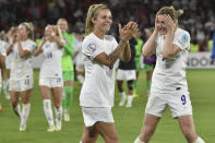 England's Leah Williamson, centre, and Ellen White celebrate as they won the Women Euro 2022 semi final soccer match between England and Sweden at the Bramall Lane Stadium in Sheffield, England, Tuesday, July 26, 2022. (AP Photo/Rui Vieira)