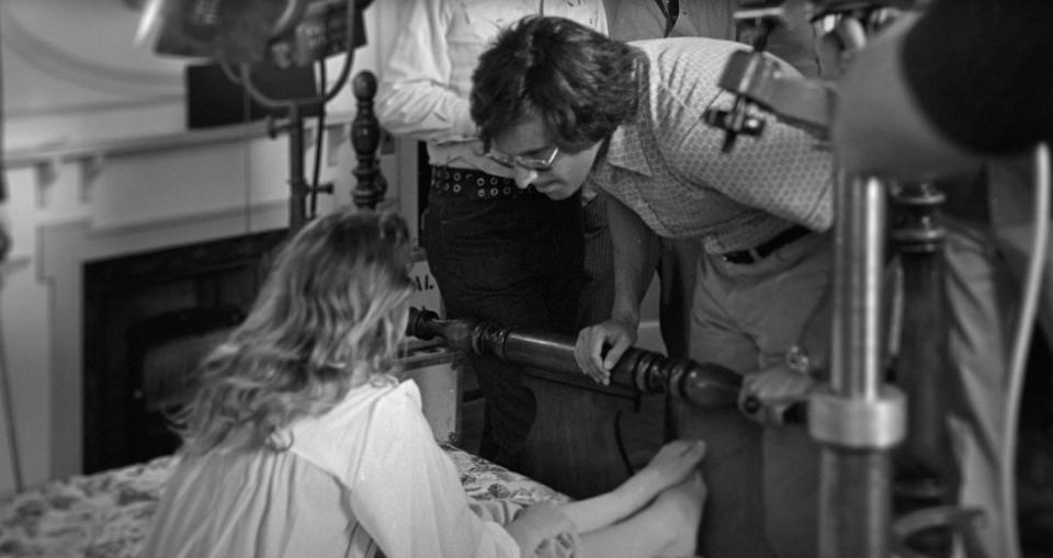 LEAP OF FAITH: WILLIAM FRIEDKIN ON THE EXORCIST, production shots from THE EXORCIST: from left: Linda Blair, director William Friedkin, on the set of THE EXORCIST, 2019. © Shudder / Courtesy Everett Collection
