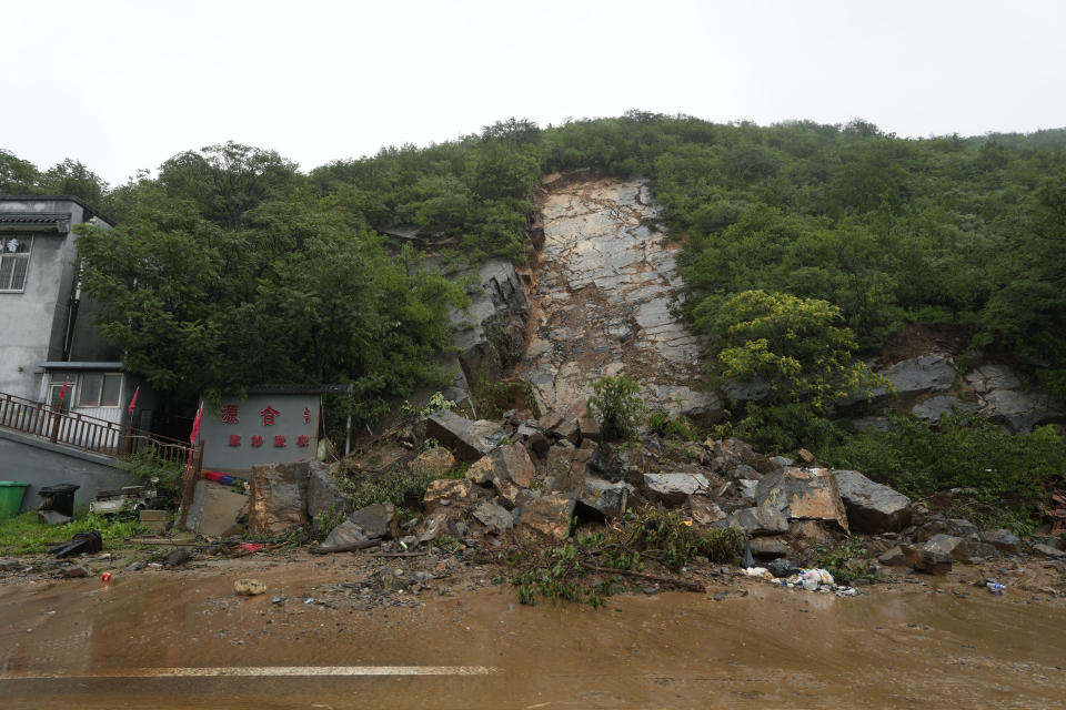 A landslide is seen in the Miaofengshan area on the outskirts of Beijing, Tuesday, Aug. 1, 2023. Chinese state media report some have died and others are missing amid flooding in the mountains surrounding the capital Beijing. (AP Photo/Ng Han Guan)